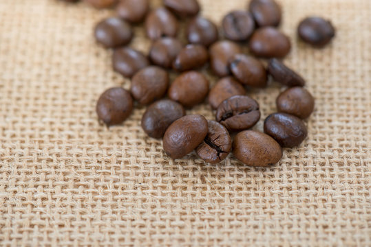 Coffee bean.Roasted coffee bean on burlap background.