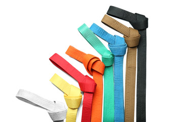 Colorful karate belts on white background © Africa Studio