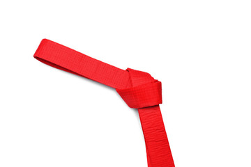 Red karate belt on white background