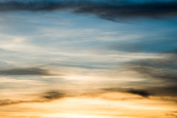 colorful dramatic sky with cloud at sunset.