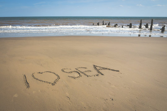 Sign on the sand beach