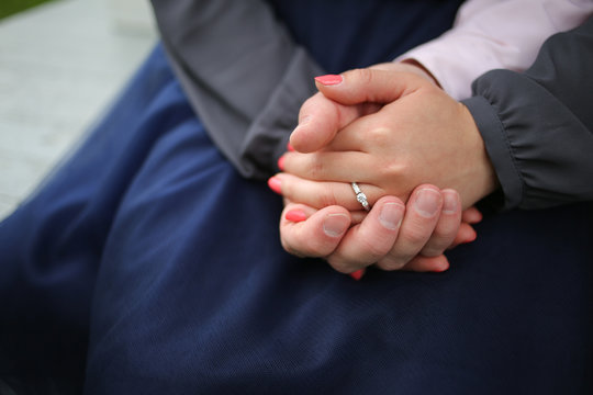 Engaged Couple Holding Hands