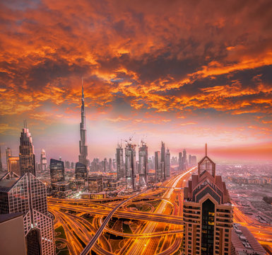 Dubai against colorful sunset with modern futuristic architecture , United Arab Emirates