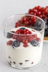 Yogurt with berries, cranberries and raspberries