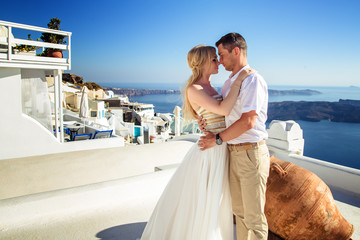 beautiful bride and groom in their summer wedding day on greek island Santorini