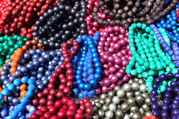 Beads colorful beautiful texture. Flat lay, top view. Red, pink, yellow, blue, green
