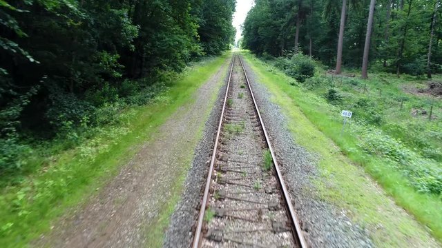Low altitude aerial flight over track on railway railroad also known as permanent way is structure consisting of rails fasteners railroad ties and ballast or slab track plus underlying subgrade 4k