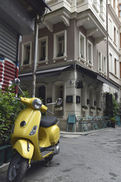 Yellow scooter in the street
