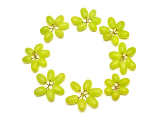 Fresh green grapes branch isolated on white background. Creative concept of fruit, butterfly shape....