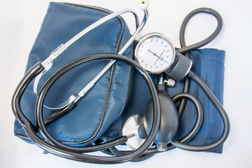 Photo set of stethoscope and arm sphygmomanometer with carrying bag or case. On white background is black stethoscope with sphygmomanometer with inflatable rubber cuff, measuring device, bulb and case