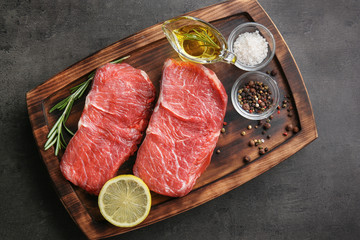 Fototapeta na wymiar Fresh raw meat on wooden board