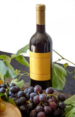 Obraz premium Bottle of white or red wine with grape ..