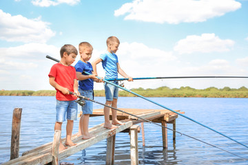 Fototapeta premium Cute children fishing on summer day