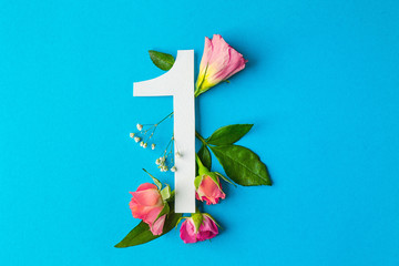 Composition with number 1 and beautiful flowers on color background