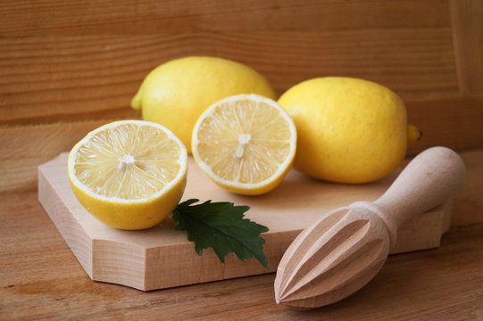 Picture with lemons on wooden background