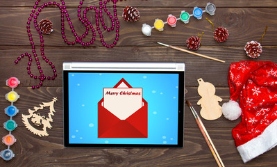 Merry Christmas, received an email on the tablet. Christmas background template.