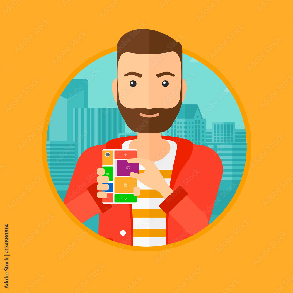 Poster a hipster man with the beard holding modular phone. young man with modular phone on a city backgroun