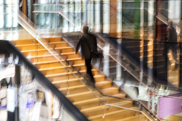 Obraz na płótnie Canvas Intentional blurred image of people walking