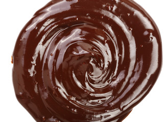 Hot melted chocolate pouring isolated on white background, top view