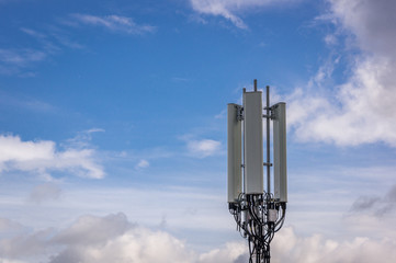 Cell tower with light clouds