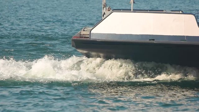 Boat on the lake, slow-mo. Splashes of water.