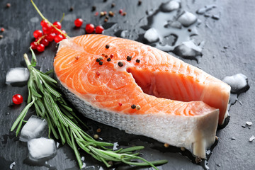 Fresh salmon steak on slate plate
