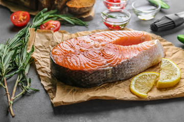 Fresh salmon steak on parchment paper