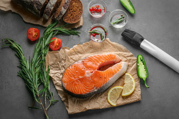 Fresh salmon steak on parchment paper
