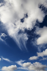 White Cumulus Clouds In Blue Sky From Airplane