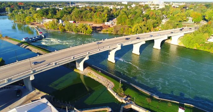 Early morning rush hour traffic on bustling city bridge, aerial view.
