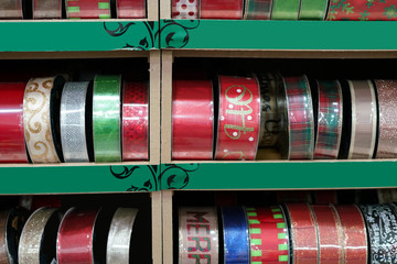 Christmas ribbon stripe roll in package on the shelf for sale