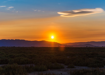 Sunset at the mouth of the Ebro Delta and wetlands, Tarragona, Catalonia, Spain. Copy space for text.