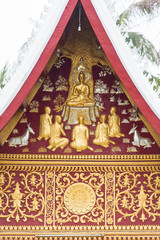 Bas-relief on the wall of the temple Wat Sensoukaram in Louangphabang, Laos. Vertical. Close-up.