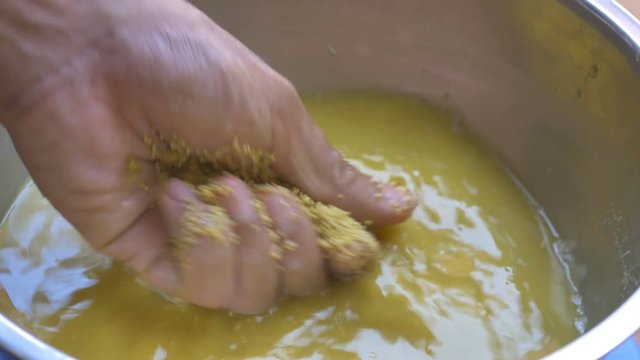 Washing Millet By Hand In Water