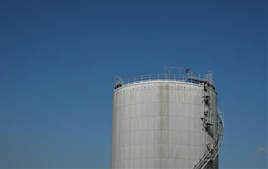 factory storage tank and blue sky on the background
