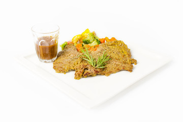 Pork steak grilled with black peper sauce and mixed vegetable