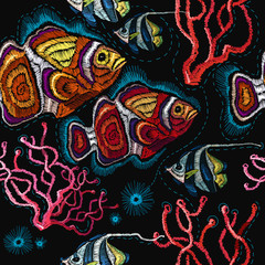Embroidery sea life, sea shells, corals, clown fish, tropical fishes seamless pattern. Classical embroidery tropical sea, wave, fishes, corals, shells seamless fashion pattern. Fashionable clothes