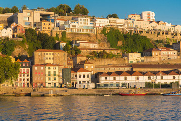 Fototapeta na wymiar Porto, Portugal, panorama of the river Douro and the quays with wine cellars 
