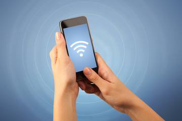 Female hand holding smartphone