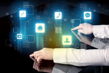 Modern smart table with high tech icons on its interface screen