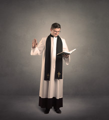 young priest in giving his blessing