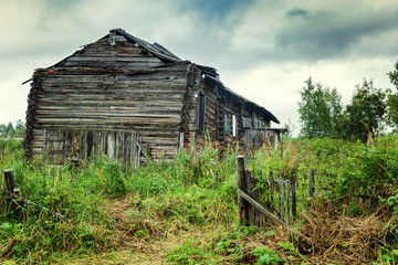 old wooden house, in the courtyard of the board, green grass