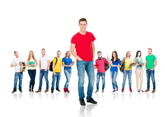 Fototapeta premium Large group of teenage students isolated on white background. Many different people standing together. School, education, college, university concept.