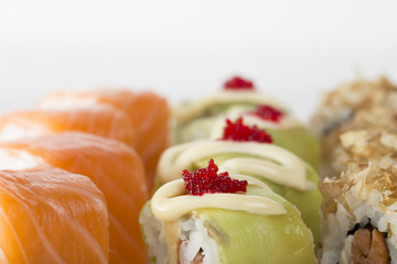 Sushi rolls with avocado and tobiko caviar.