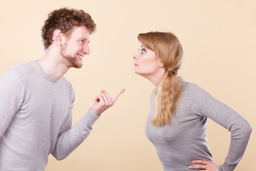 Young emotional couple arguing.