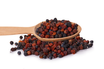 dried berries in wooden spoon isolated on white background