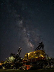 Quarry excavator loader with the milky way background. © aedkafl