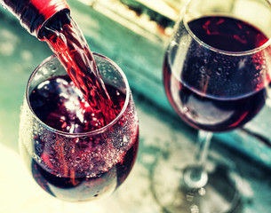  pouring red wine. Wine in a glass, selective focus, motion blur,