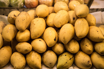 yellow Mango on the counter at the market