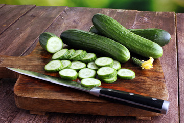 Fresh and sliced cucumbers. Sliced cucumbers on a cutting board. cucumbers for diet and healthy eating